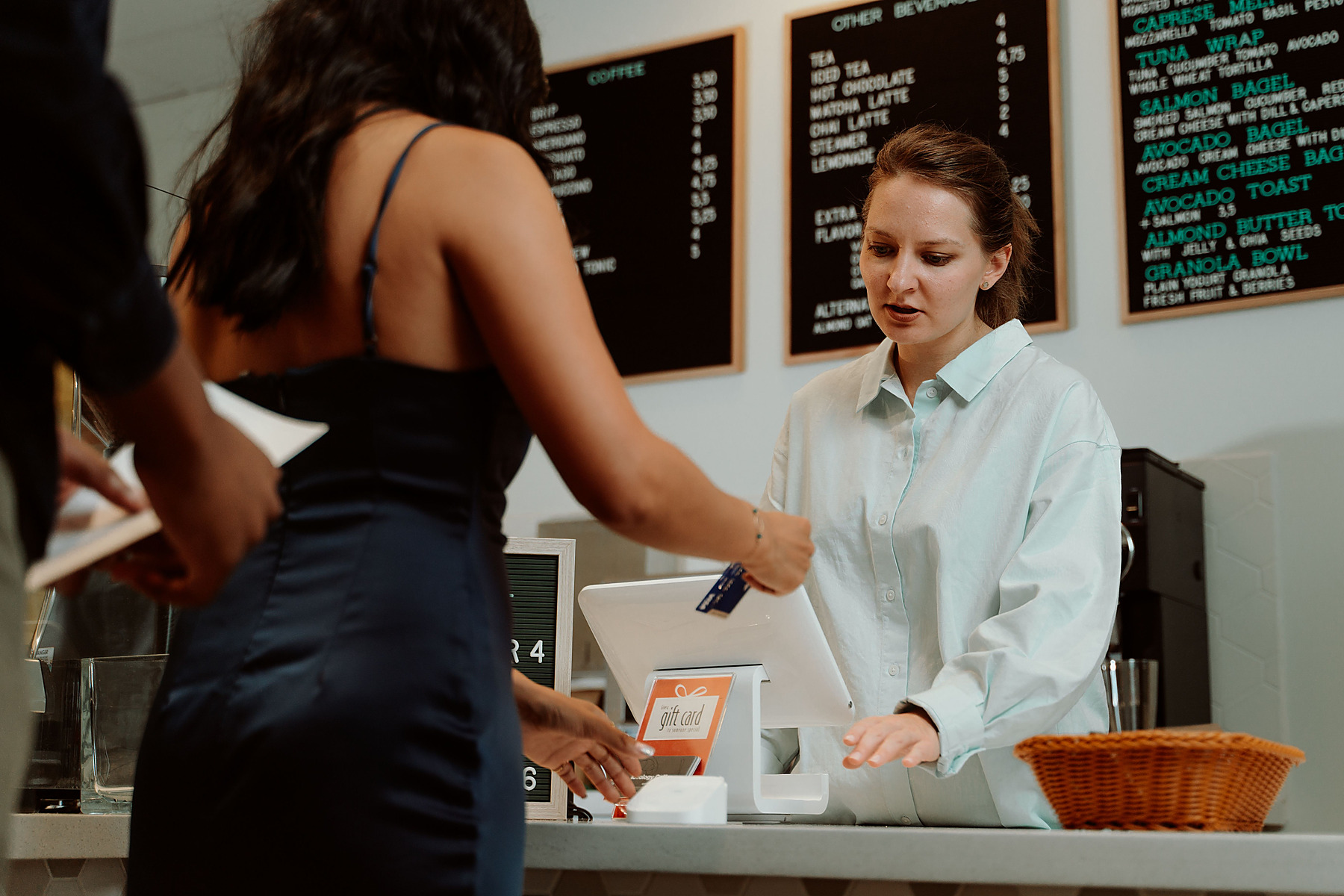 Customer paying with a card at a small business counter